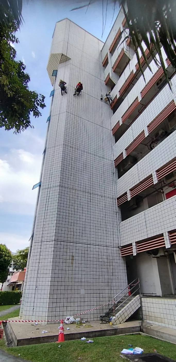 rope access technicians inspecting a tiled high-rise façade in Singapore for BCA Periodic Façade Inspection