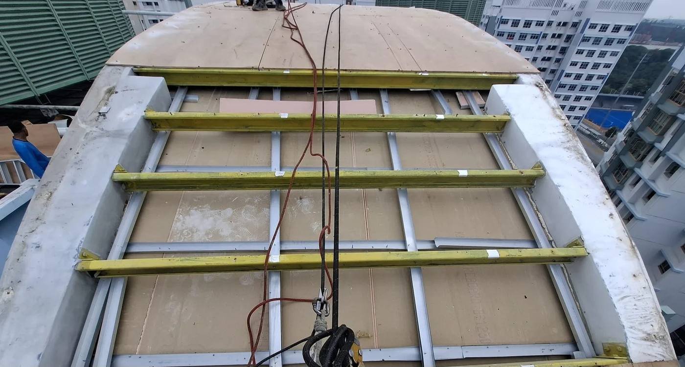 Metal roofing installation in progress on a Singapore building by Skyline Rope Tech