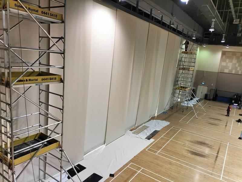 Supply and replacement of large roller blinds in a Singapore hall by Skyline Rope Tech